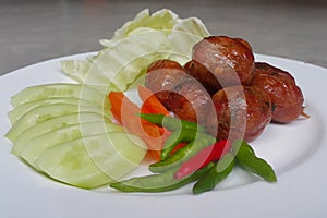 Grilled Thai style spicy pork susage.