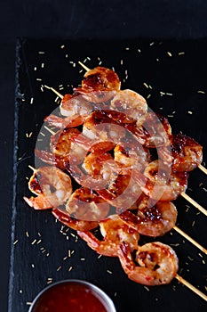 Grilled tiger shrimp kebab with sauce. Appetizer for beer.Flat lay. Top view.