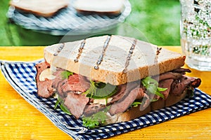 Grilled toasted sandwich with rare roast beef