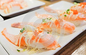 Grilled toro salmon sushi sake nigiri with shrimp eggs tobiko photo