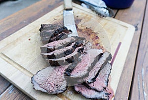 Sliced Tri Tip on a cutting board photo