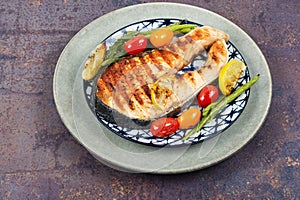 Grilled trout steak on a plate