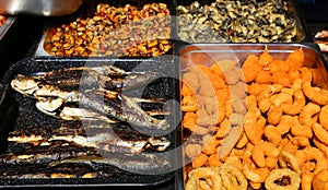 Grilled trouts, calamar rings and shells photo
