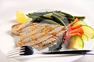 Grilled tuna meal with fork
