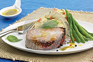 Grilled tuna steak with basil olive oil