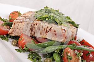 Grilled tuna steak with bean and tomato salad