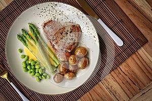 Grilled tuna steak served with asparagus