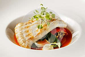 Grilled turbot, tabouli, sweet pepper sauce and summer vegetables. White dish