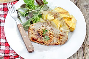 Grilled turkey cutlet and potato gratin