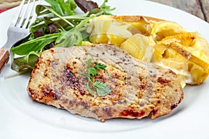 Grilled turkey cutlet and potato gratin