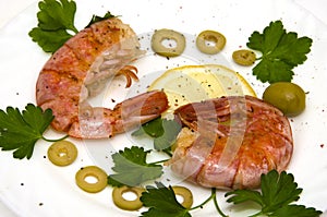 Grilled two large shrimp on round white plate