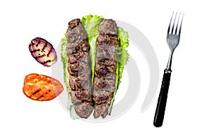Grilled Urfa kebab with tomato, salad and onion. Isolated, white background.