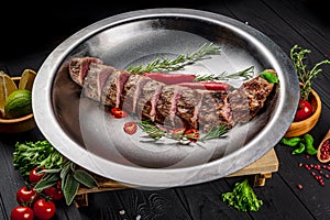 Grilled veal tenderloin. Juicy steak medium rare beef with spices