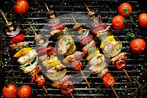 Grilled vegetable and meat skewers in a herb marinade on a grill pan