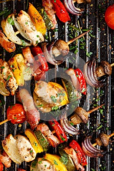 Grilled vegetable and meat skewers in a herb marinade on a grill pan