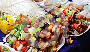 Grilled vegetable and meat skewers sold in an Asian food street market