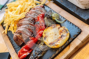 Grilled vegetables and meat. Potatoes, peppers, barbecue steak. food close-up