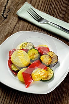 Grilled vegetables on a old wooden table