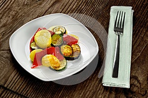 Grilled vegetables on a old wooden table