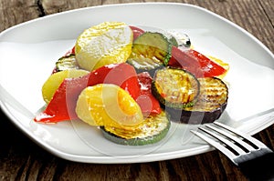 Grilled vegetables on a old wooden table