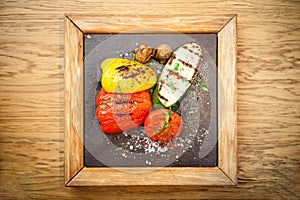 Grilled vegetables on a stone board