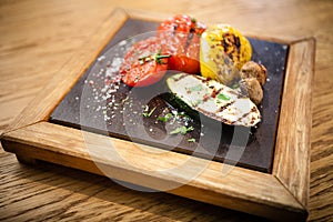 Grilled vegetables on a stone board