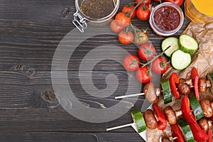 Grilled vegetarian meal on the wooden table, top view. Barbecue party outdoor