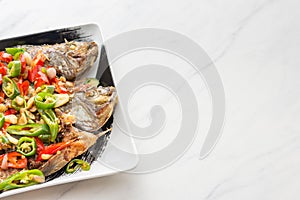Grilled whole fish with spicy salad dressing asian style cuisine and cooking