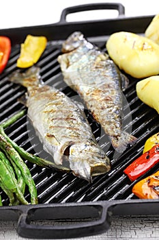 Grilled whole rainbow trout with vegetables