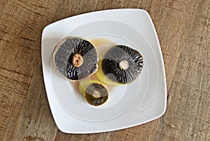 Grilled wild mushrooms Agaricus campestris with olive oil.