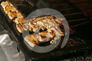 Grilled yakitori chicken skewers at an Izakaya restaurant