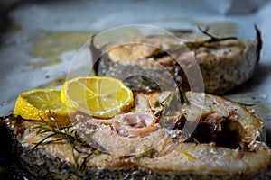Grilled yellowtail amberjack with lemon slices.
