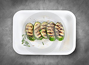 Grilled zucchini. Healthly food. Takeaway food. Top view, on a gray background