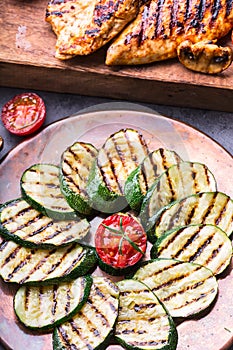 Grilled Zucchini Tomato with chili pepper. Italian mediterranean or greek cuisine. Vegan vegetarian food