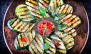 Grilled Zucchini Tomato with chili pepper. Italian mediterranean or greek cuisine. Vegan vegetarian food