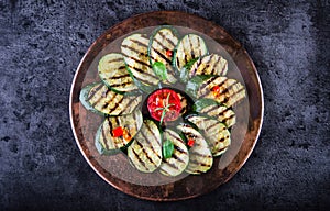 Grilled Zucchini Tomato with chili pepper. Italian mediterranean or greek cuisine. Vegan vegetarian food