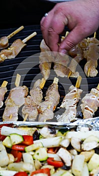 Grilling chicken sate and vegetables