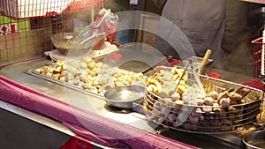 Grilling dumplings at Lehua Night Market