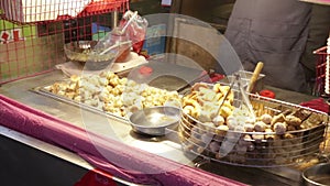 Grilling dumplings at Lehua Night Market