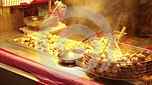 Grilling dumplings at Lehua Night Market