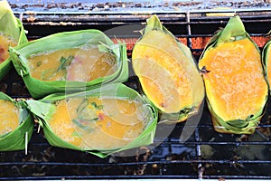 Grilling eggs with banana leaves