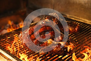 Grilling grate with pork foreshanks in oven