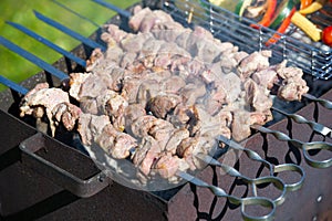 Grilling marinated shashlik on a grill