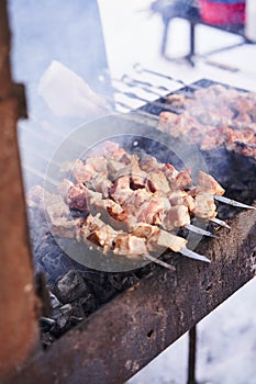 Grilling marinated shashlik on a grill. Shashlik is a form of Shish kebab popular in Europe and other places