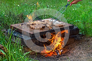 Grilling meat and sausages