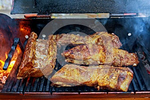 grilling ribs over flaming grill pork ribs on a grill a wood fire