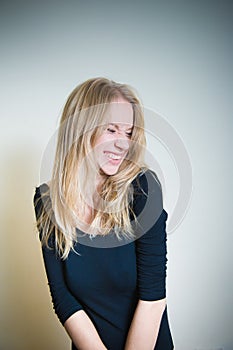 Grimace of young blonde woman portrait
