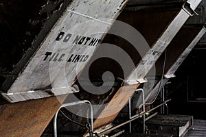 Grimy Machine and Hand Painted Sign - Abandoned Factory - New York