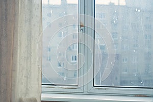 grimy window in apartment, requiring thorough cleaning Close up