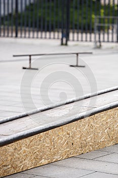 Grind box with skate rails in skatepark outdoor